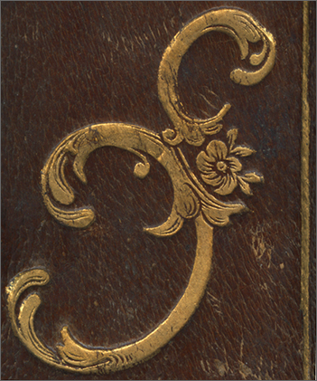 ferro con fiorellino centrale, dal dorso della legatura ferro con fiorellino centrale, dal dorso della legatura